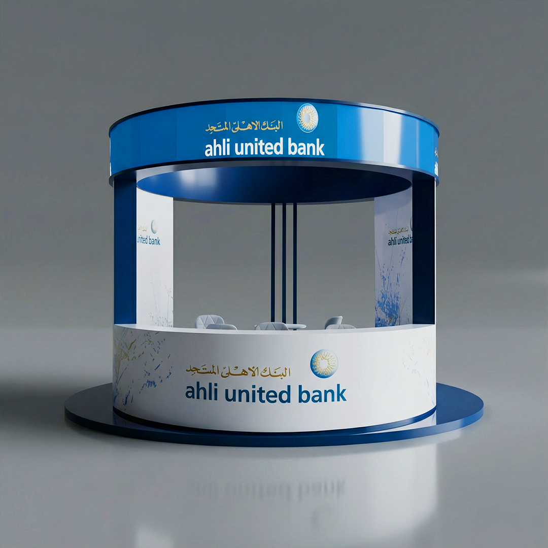 Ahli United Bank exhibition booth with circular design, blue and white branding, and seating area for visitors